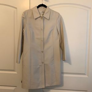 Trench coat — stylish, lightweight, lined with pockets.